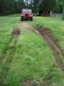 ruts where trailer tires were; jeep in 4-wheel drive low, pushing the camper....