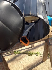 Next, cut off the bottom of the trash can.