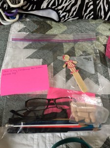This was before I left home. My little stick friend had to wait in the hotel room, along with my pink 3x5 note cards. The glasses, earbuds, and pencils were all allowed.